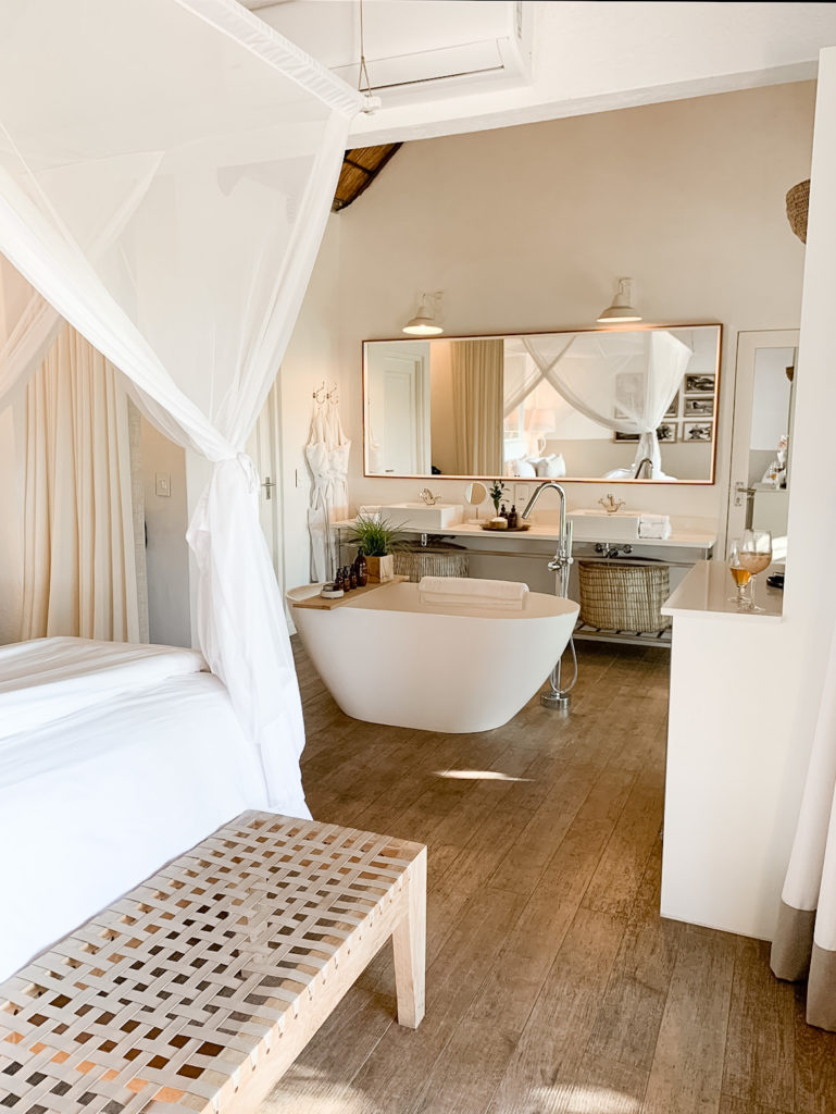 White Bedroom and Bathroom Interior Design in South African Safari Lodge.