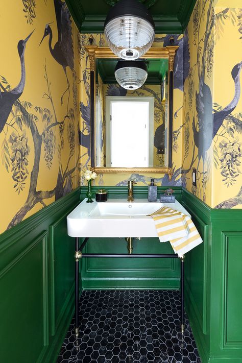 yellow bird wallpaper with green panel wainscot in bathroom